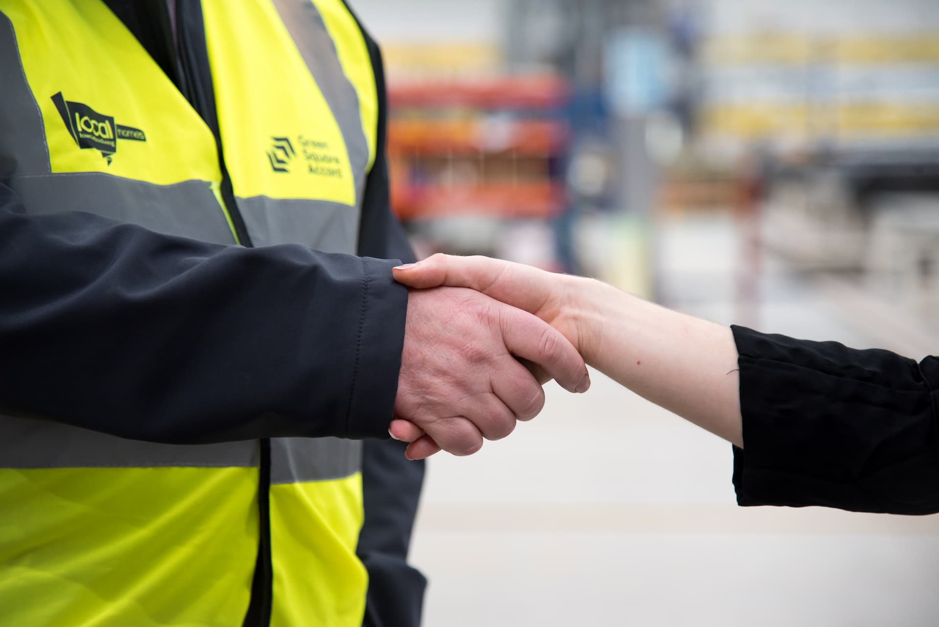 A LoCaL Homes employee shaking a partner's hand
