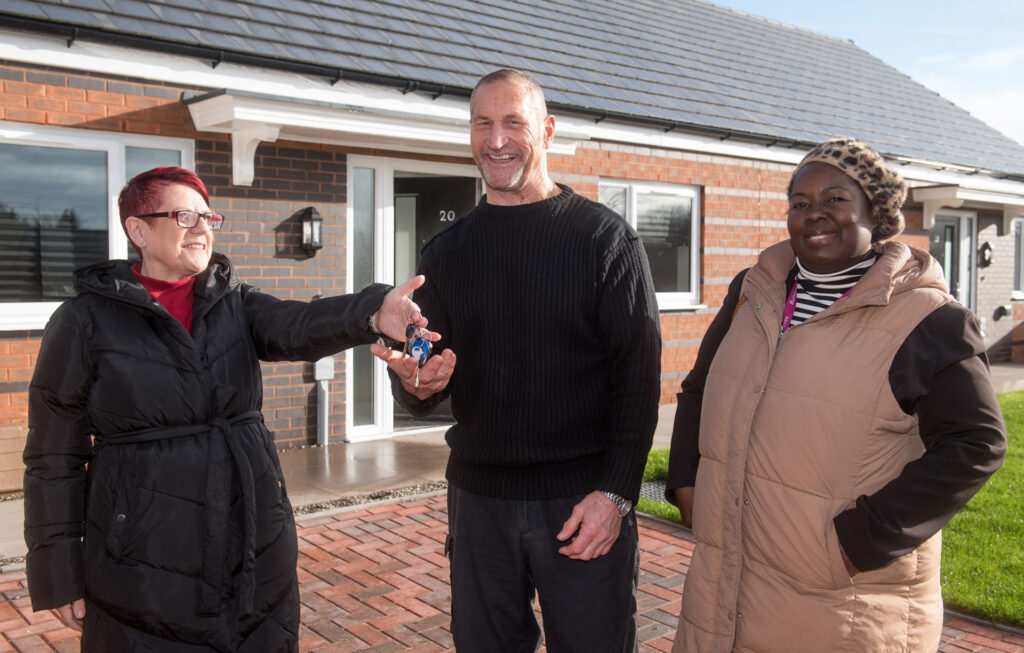 Tony Birrell getting the keys to his new home at the Lightmoor Road development